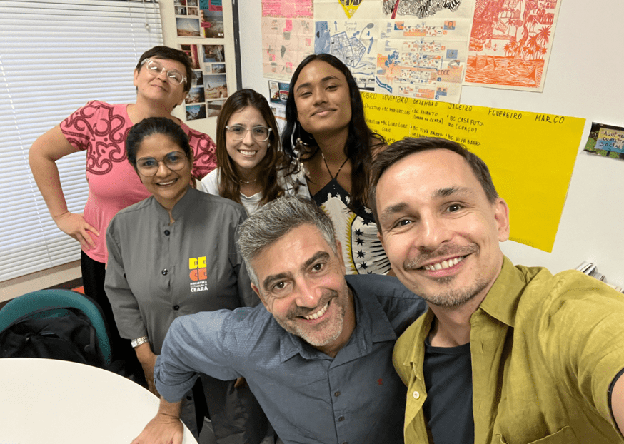 Visiting library staff in Fortaleza, Brazil | January 2023 A group of people gathered with Public Innovation Fellow Tommi Laitio and smiling for the camera